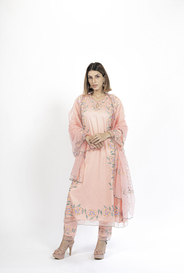 Elegant peach pheran kurti set featuring intricate Aari embroidery with floral patterns, paired with matching cotton bottoms and an organza dupatta by VaadiByLiza.