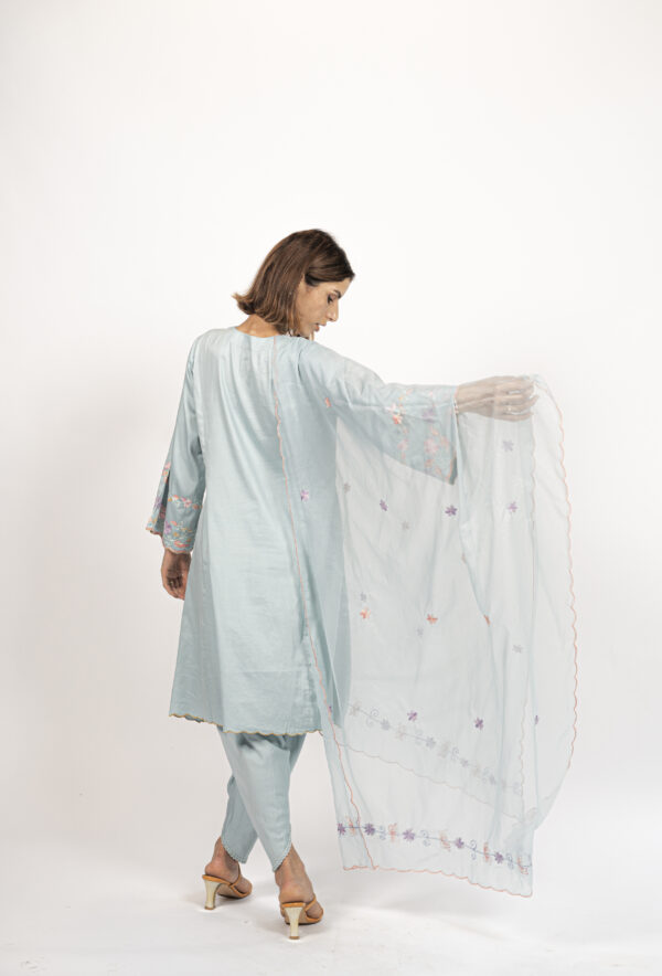 Back view of the sky blue Aari-embroidered Kalidar kurta set by VaadiByLiza, showcasing delicate floral detailing on the dupatta and sleeves.