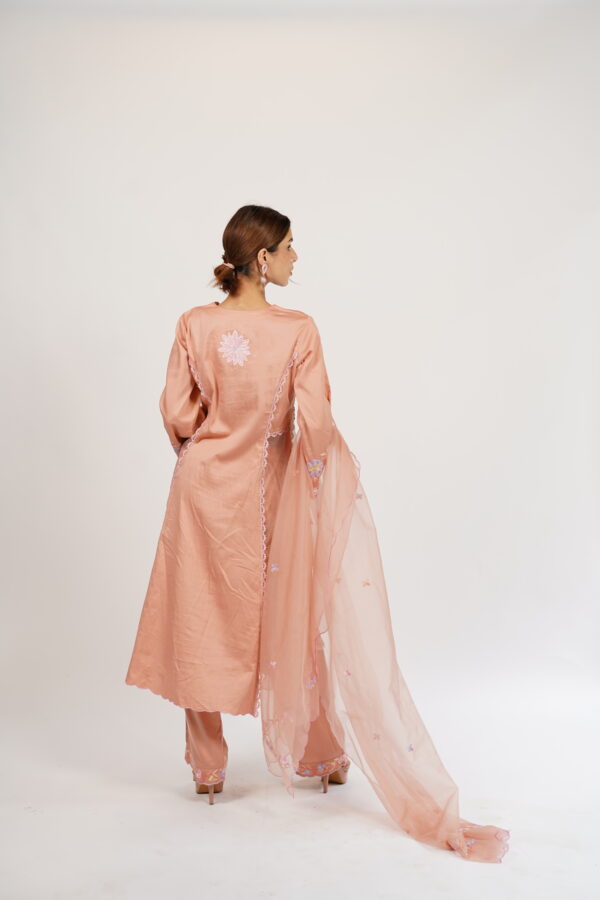 Back view of the VaadiByLiza Lady Tulip Kalidar Kurta Set in salmon peach, showcasing delicate Aari embroidery and a flowing silhouette.