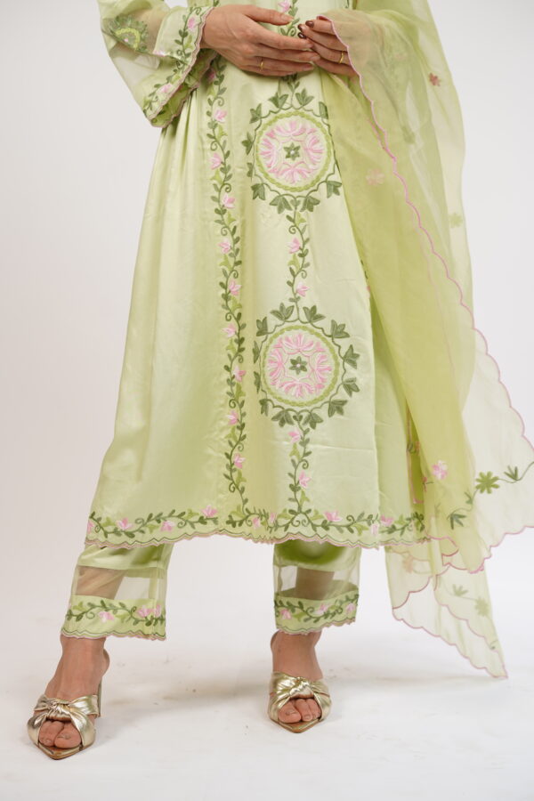 Full-length view of a soft green embroidered kurta set with matching modal satin pants.