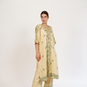 Full-length view of a beige kaftan-style kurta paired with matching pants.